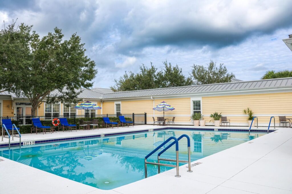 Outdoor Swimming Pool with Safety Features at Port Saint Lucie Retirement Communities