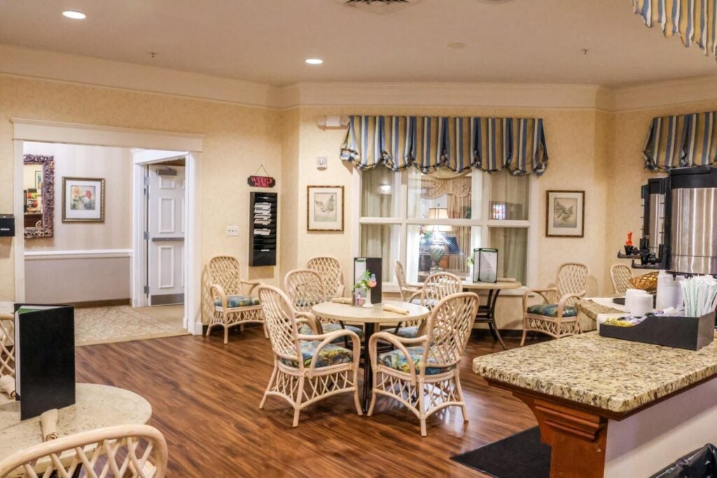 Casual Dining Area with Kitchen Access at Assisted Living Facility