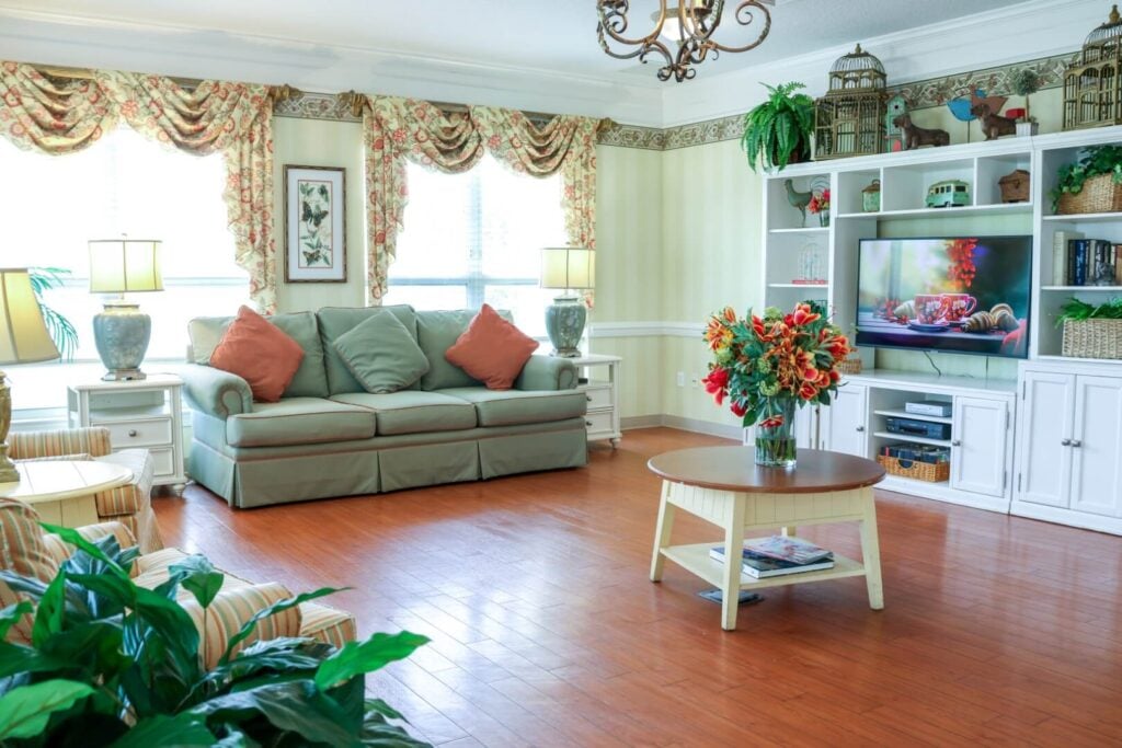 Bright Living Room with Entertainment Center at Independent Living Facility