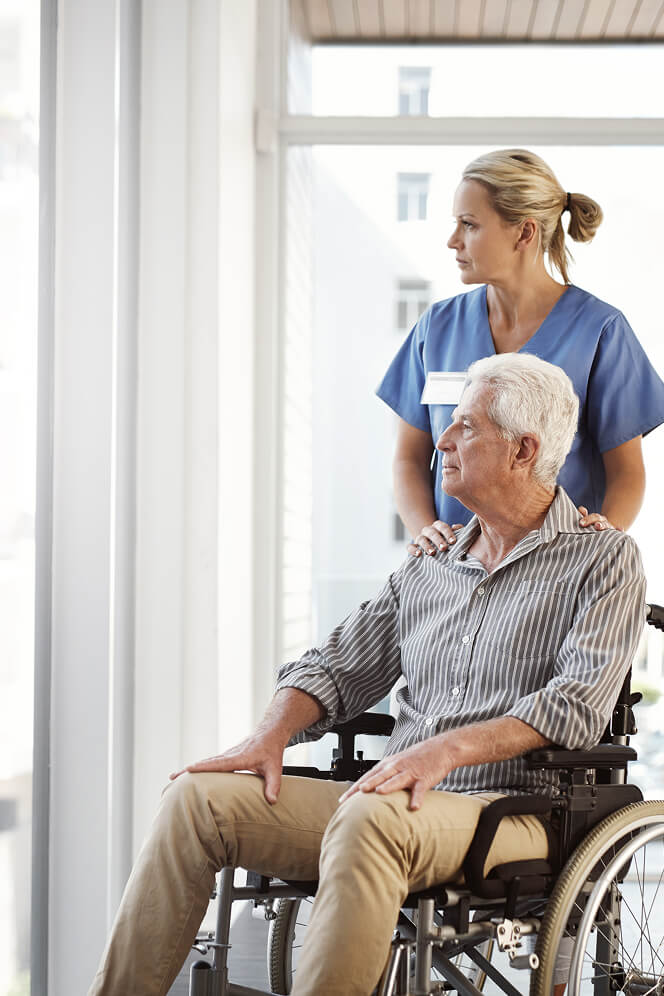 Nurse Comforting Elderly Woman at Nursing Home Colleyville