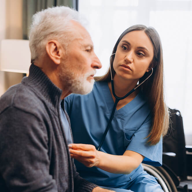 Caregiver Comforting Resident at Memory Care Facility